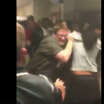 Teacher breaking up fight