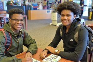 Jared Leviston and Quintrell Hill get books PBS