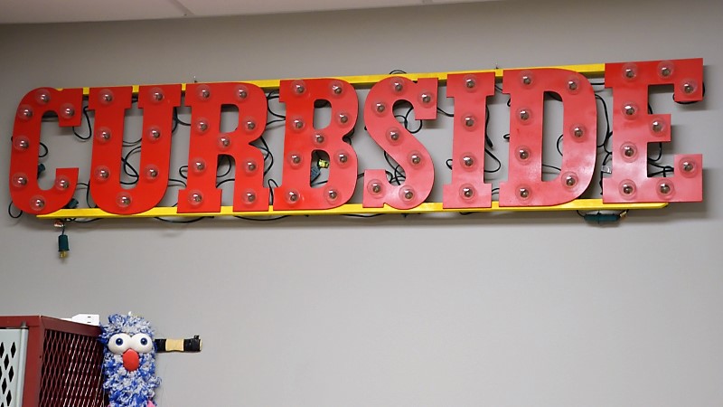Curbside Chronicle sign in their one-room office where the new editor will work, too
