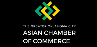 Logo for The Greater Oklahoma City Asian Chamber of Commerce: teal and yellow geometric emblem above the organization name on a black background.