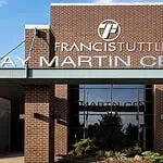 PRESS RELEASE: Francis Tuttle welcomes employers, job seekers for Community Job Fair May 6 Entrance to Francis Institute Kay Martin Center: brick façade, glass doors, and landscaped planters under a clear blue sky.