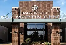 PRESS RELEASE: Francis Tuttle welcomes employers, job seekers for Community Job Fair May 6 Entrance to Francis Institute Kay Martin Center: brick façade, glass doors, and landscaped planters under a clear blue sky.