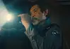 deadCenter features go heavy on history, diversity, modern battles Male officer in uniform shines a flashlight into a dim room, beam across the scene,