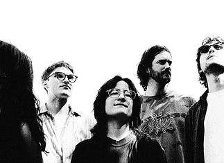 Mad Honey build alt-rock landmark on ‘Bridge Over Cumberland’ Five-person rock band standing side by side, looking up, in a black-and-white photo.