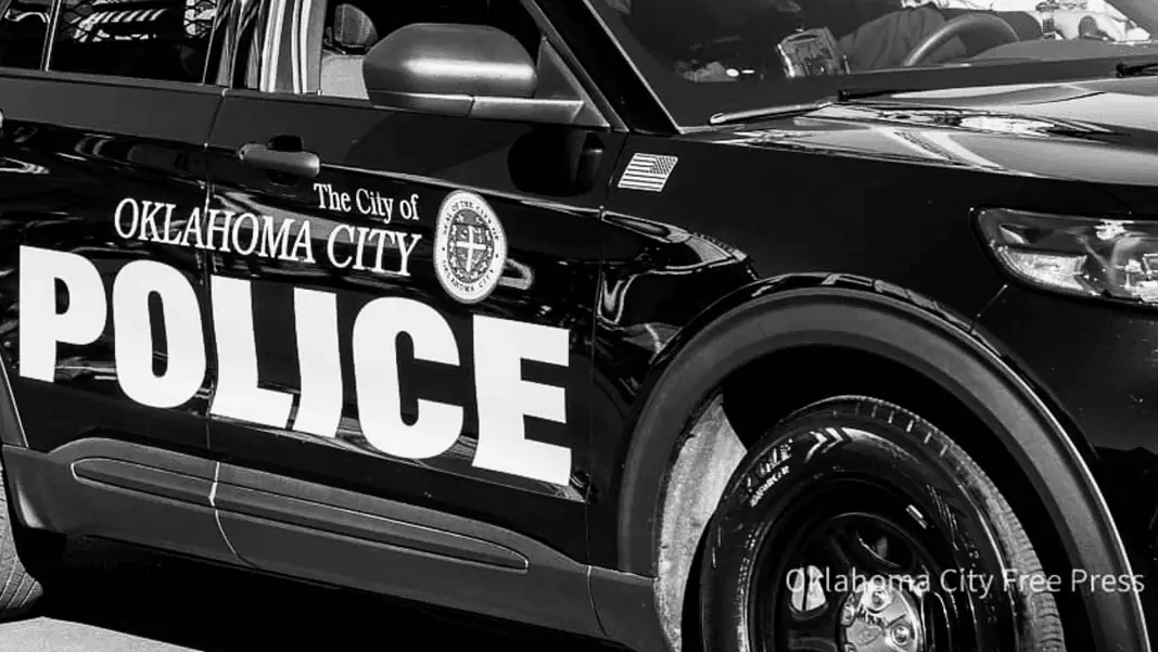 Police vehicle edited Black-and-white photo of an Oklahoma City Police Department patrol car with large POLICE lettering on the side.