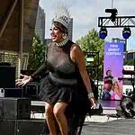 PrideFest 2026 kicks off with joy, community at Scissortail Park Drag performer wearing a tall silver crown and black sequined outfit performing on an outdoor stage at the Two Spirit Festival