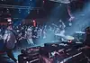 Showcases, mini-fests lift energy, noise, next generation of OKC music Band performs on stage in a crowded club, guitarist at left, drummer on the right, blue and red stage lights illuminating the audience.