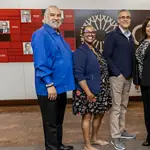 PRESS RELEASE: OCCC TRIO program honored nationally for advancing student success Six diverse professionals pose for a group photo in an office lobby with a red panel wall behind them.
