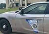 Acting Cleveland Co. sheriff calls for special election, FBI review Side of a silver sheriff patrol car with a Cleveland County badge and an Ohio-shaped decal reading 'Serving since 1889'.