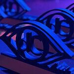 Here are the award winners of the 2026 deadCenter Film Festival! Close-up of ornate black metal eye-shaped sculptures resting on a keyboard, lit in blue and purple stage lighting.