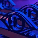 Here are the award winners of the 2026 deadCenter Film Festival! Close-up of ornate black metal eye-shaped sculptures resting on a keyboard, lit in blue and purple stage lighting.