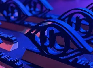 Here are the award winners of the 2026 deadCenter Film Festival! Close-up of ornate black metal eye-shaped sculptures resting on a keyboard, lit in blue and purple stage lighting.