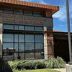 Edmond Schools nix recently renewed contracts; taxpayers cover cost Edmond Public Schools Board of Education building with brick exterior and large windows under a blue sky