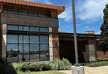 Edmond Schools nix recently renewed contracts; taxpayers cover cost Edmond Public Schools Board of Education building with brick exterior and large windows under a blue sky
