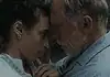 Hypnotic, unsettling ‘Night Nurse’ a piercing portrait of sociopathy Young woman and an older man press foreheads together in a tender, intimate moment beside a wall.