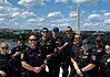 OKC police in DC: Dept says no concern or cost to public at home Group of police officers posing for a photo on a boat or dock with the Washington Monument in the background along the Potomac River