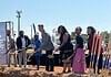 Clara Luper Civil Rights Center celebrates long-awaited groundbreaking Diverse group at a groundbreaking ceremony, each person with a shovel poised to dig on a dirt mound, banners in background.