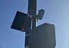 City to vote on sweeping ‘guardrails’ for Flock cameras as OKCPD continues use Streetlight pole with a solar panel, security camera, and large control box against a blue sky.